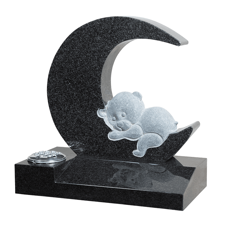 Teddy bear sleeping on half moon memorial